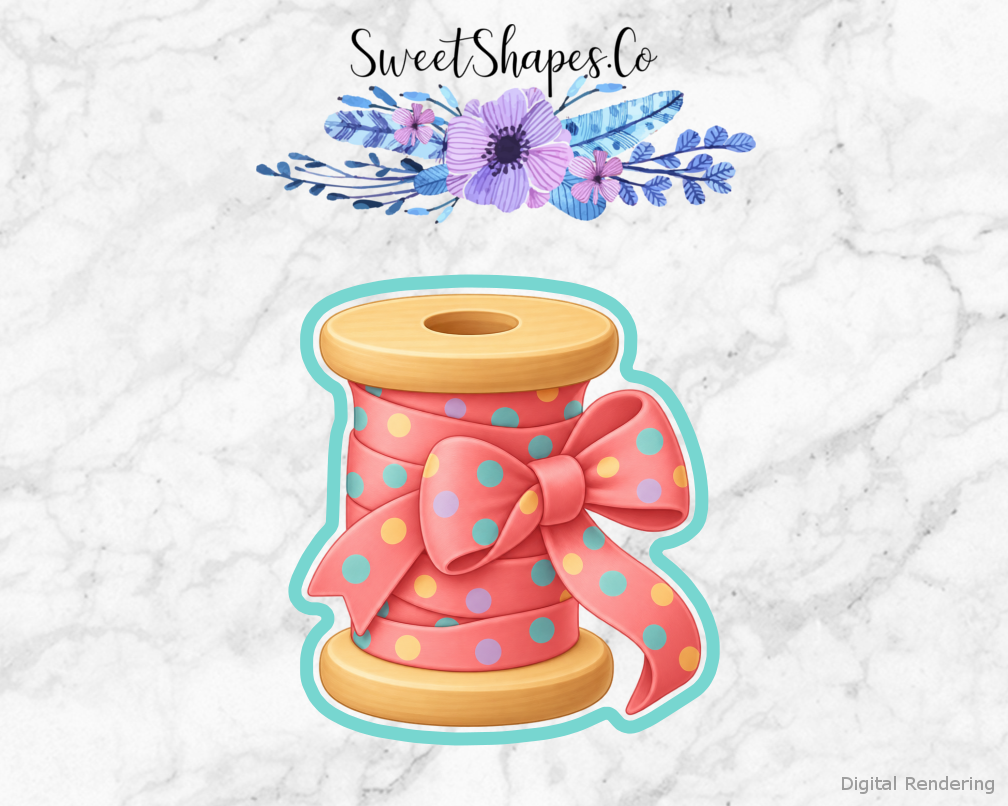 Craft Room Thread Spool with Ribbon cookie cutter artwork with teal cutting outline - part of the Craft Room Creative Day set