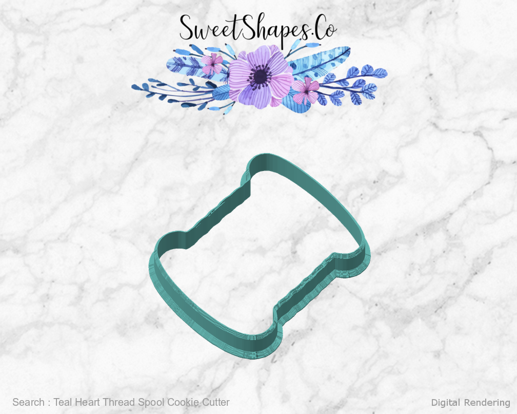 Teal Heart Thread Spool Cookie Cutter — angled front view