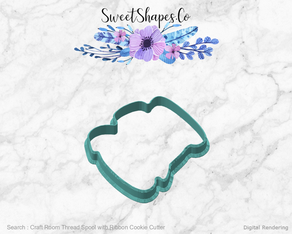 Craft Room Thread Spool with Ribbon Cookie Cutter — angled front view